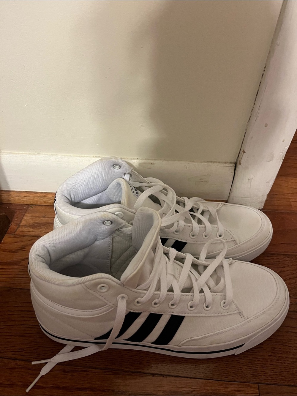Men’s black and white high top Adidas